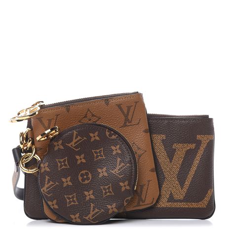 reverse monogram giant trio pouch.